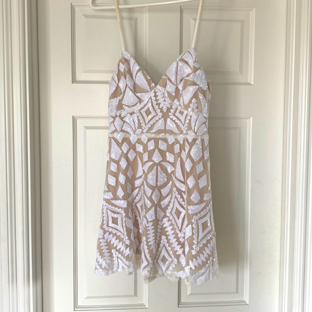 White sequin mini dress with beige lining. Bachelorette party perfection!